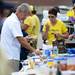 Fans check out a long table of food as they tailgate before the start of the season home opener against Central Michigan at Michigan Stadium on Saturday, August 31, 2013. Melanie Maxwell | AnnArbor.com
